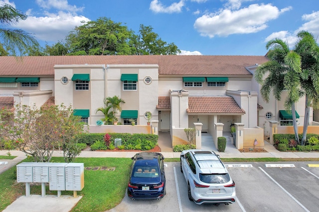 view of property with uncovered parking
