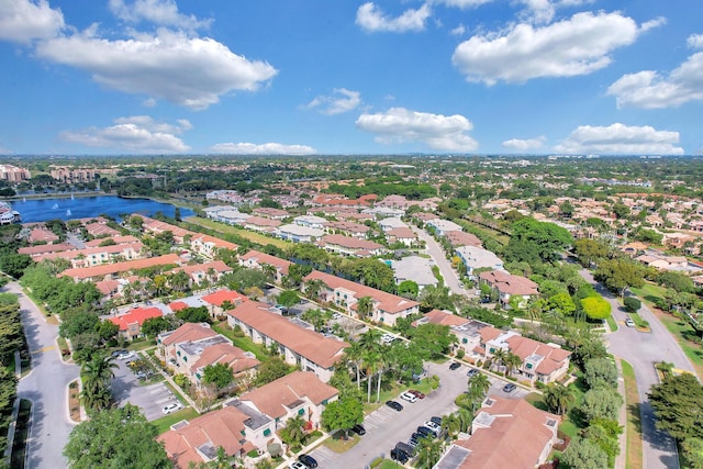 birds eye view of property with a residential view and a water view