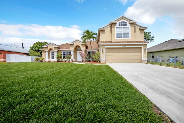 1355 SW Porter Rd, Port Saint Lucie, FL 34953 - view of front of home with fence, a garage, concrete driveway, a front yard, and stucco siding