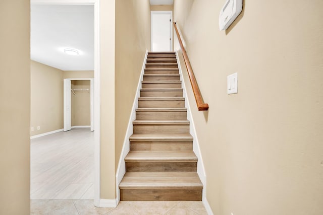 1355 SW Porter Rd, Port Saint Lucie, FL 34953 - stairway with tile patterned flooring and baseboards