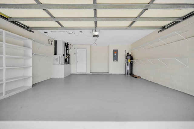 1355 SW Porter Rd, Port Saint Lucie, FL 34953 - garage with concrete block wall, electric water heater, a garage door opener, and electric panel