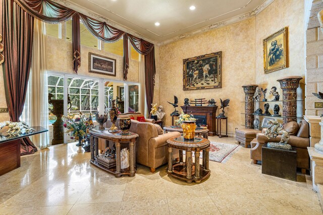 16090 Rio Del Paz, Delray Beach, FL 33446 - living room with ornamental molding, a fireplace, a high ceiling, and recessed lighting