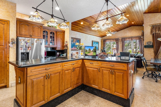 16090 Rio Del Paz, Delray Beach, FL 33446 - kitchen with stainless steel refrigerator with ice dispenser, brown cabinetry, open floor plan, wooden ceiling, and glass insert cabinets