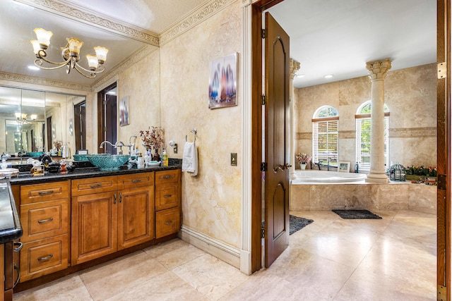 16090 Rio Del Paz, Delray Beach, FL 33446 - bathroom featuring a chandelier, a bath, vanity, decorative columns, and baseboards