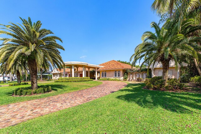 16090 Rio Del Paz, Delray Beach, FL 33446 - view of green lawn with decorative driveway