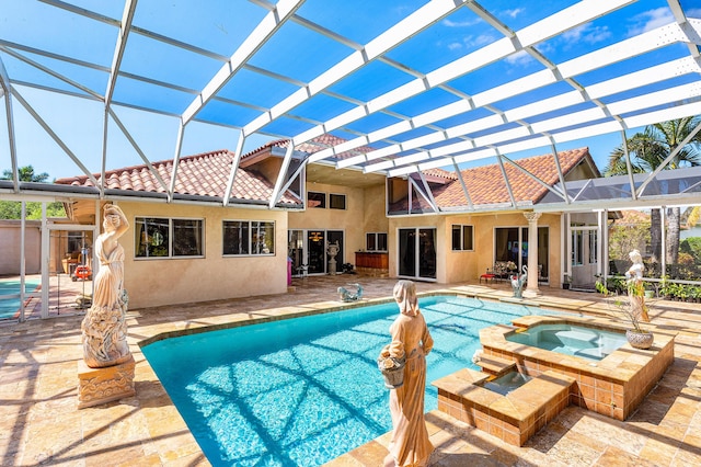 16090 Rio Del Paz, Delray Beach, FL 33446 - view of pool featuring glass enclosure, a patio, and a pool with connected hot tub