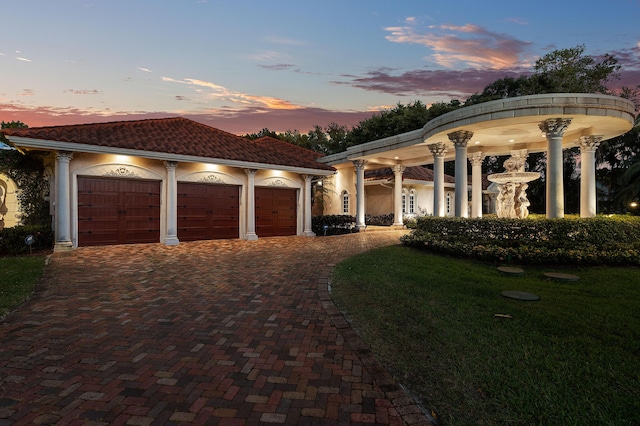 16090 Rio Del Paz, Delray Beach, FL 33446 - greek revival inspired property with decorative driveway, an attached garage, a tile roof, and stucco siding