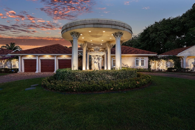16090 Rio Del Paz, Delray Beach, FL 33446 - view of front of home featuring a yard, driveway, a garage, and stucco siding