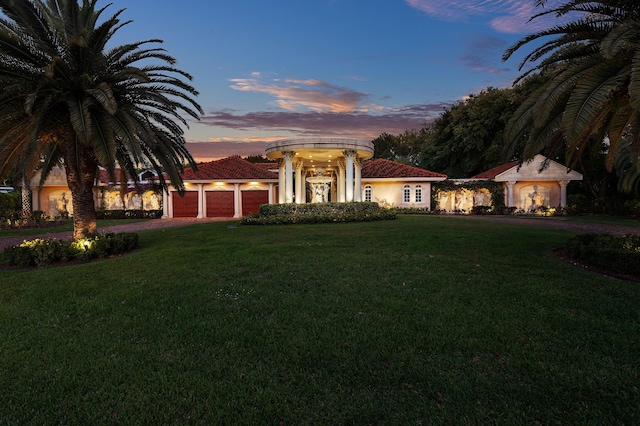 16090 Rio Del Paz, Delray Beach, FL 33446 - mediterranean / spanish-style house featuring a garage, a front lawn, stucco siding, and driveway
