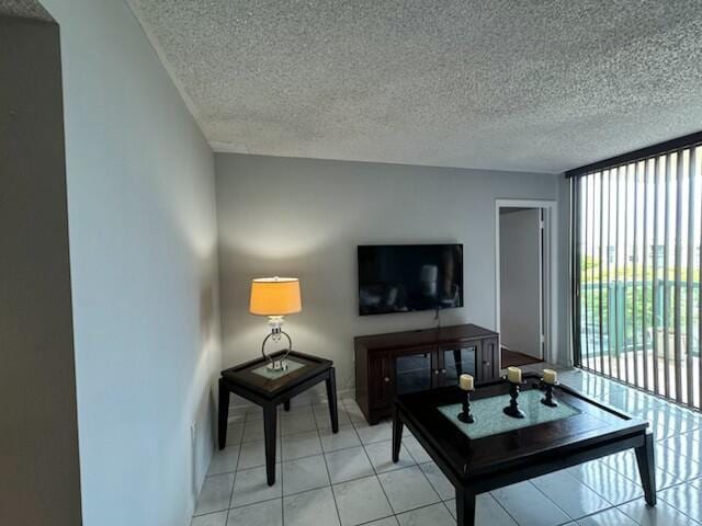 2075 SW 122nd Ave Unit 513, Miami, FL 33175 - living room with floor to ceiling windows, light tile patterned floors, and a textured ceiling