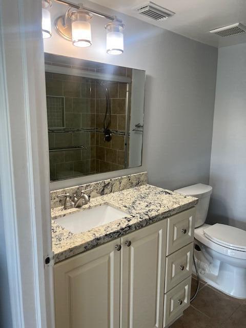 2075 SW 122nd Ave Unit 513, Miami, FL 33175 - bathroom with visible vents, toilet, tile patterned flooring, and vanity
