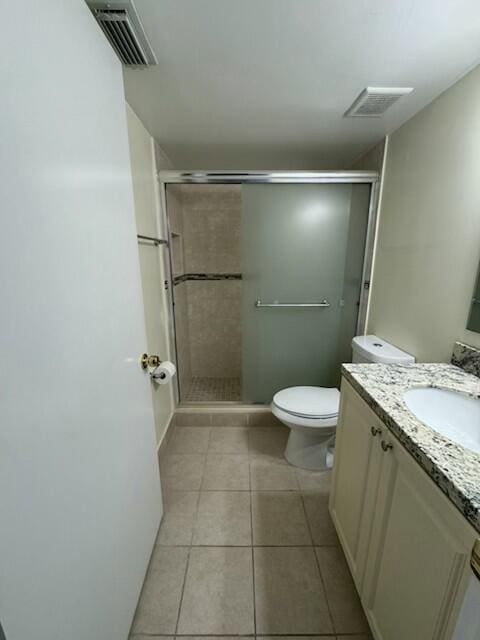 2075 SW 122nd Ave Unit 513, Miami, FL 33175 - bathroom with tile patterned floors, toilet, a stall shower, and visible vents