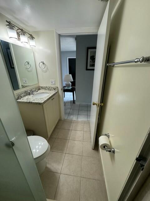 2075 SW 122nd Ave Unit 513, Miami, FL 33175 - bathroom with toilet, tile patterned floors, and vanity