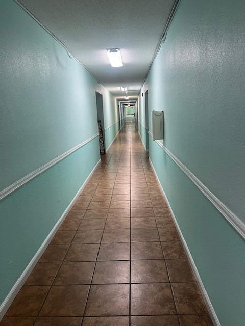 2075 SW 122nd Ave Unit 513, Miami, FL 33175 - hall with baseboards and tile patterned floors