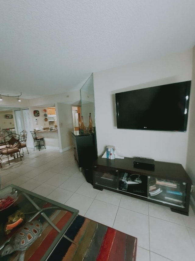 living area featuring light tile patterned floors