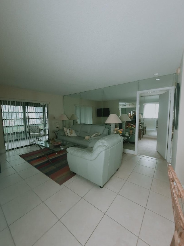 living area with tile patterned floors