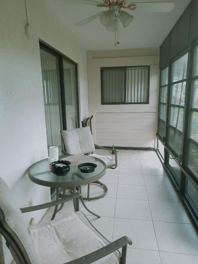 sunroom featuring tile patterned flooring