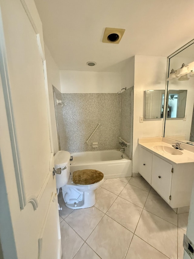 full bathroom with tile patterned floors, shower / washtub combination, toilet, and vanity