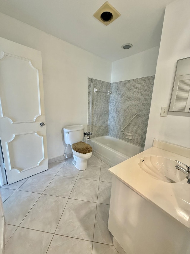full bathroom with baseboards, toilet, vanity, tile patterned floors, and washtub / shower combination