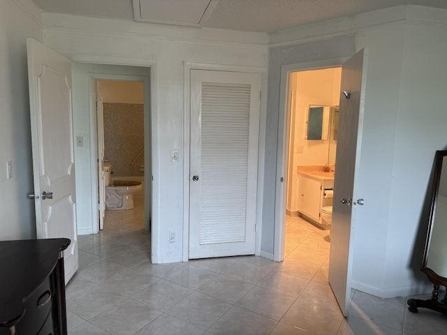 interior space featuring a sink and light tile patterned flooring