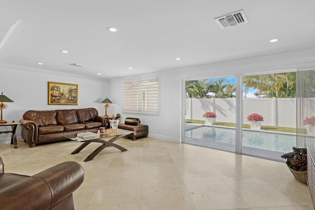 6611 NE 21st Ln, Fort Lauderdale, FL 33308 - living room featuring baseboards, visible vents, recessed lighting, and crown molding