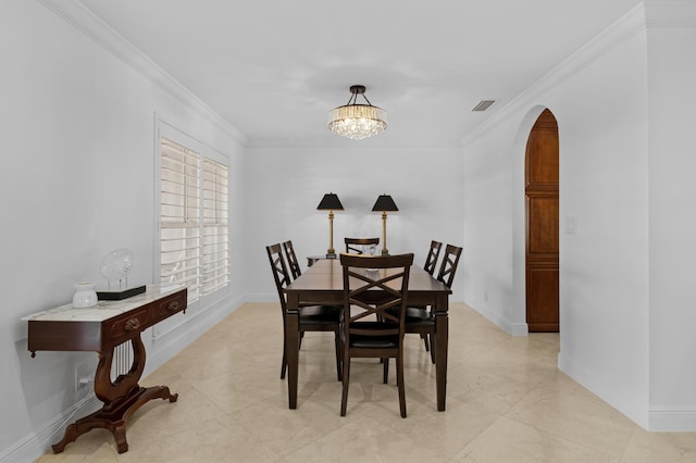 6611 NE 21st Ln, Fort Lauderdale, FL 33308 - dining area with arched walkways, baseboards, visible vents, and crown molding