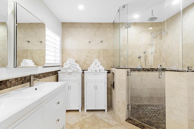 6611 NE 21st Ln, Fort Lauderdale, FL 33308 - full bathroom featuring a shower stall, tile walls, double vanity, and a sink