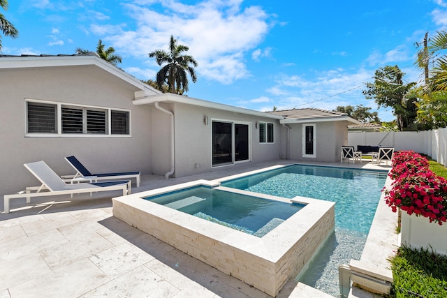 6611 NE 21st Ln, Fort Lauderdale, FL 33308 - view of pool with a patio, a fenced backyard, and a pool with connected hot tub