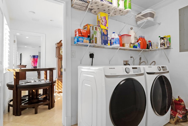 6611 NE 21st Ln, Fort Lauderdale, FL 33308 - washroom featuring light tile patterned floors, ornamental molding, washer and dryer, and laundry area