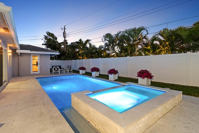 6611 NE 21st Ln, Fort Lauderdale, FL 33308 - view of pool with a fenced backyard, a pool with connected hot tub, and a patio