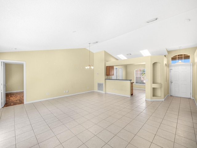 unfurnished living room featuring light tile patterned floors, visible vents, an inviting chandelier, and vaulted ceiling