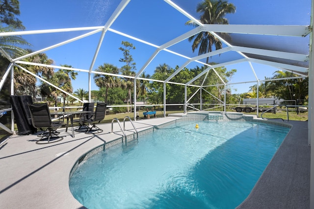 131 NE Naranja Ave, Port Saint Lucie, FL 34983 - view of pool with a pool with connected hot tub, a lanai, and a patio area