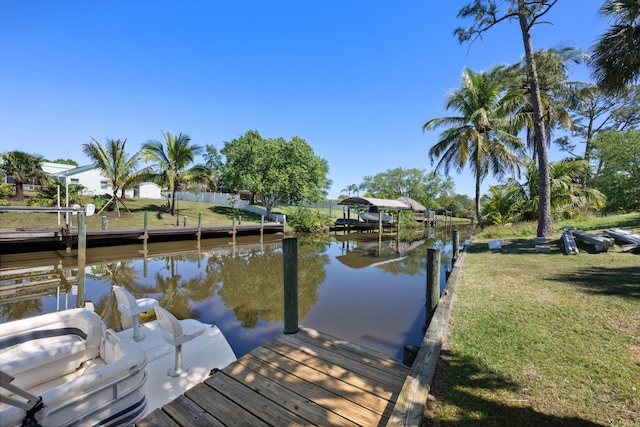 131 NE Naranja Ave, Port Saint Lucie, FL 34983 - dock area featuring a yard and a water view