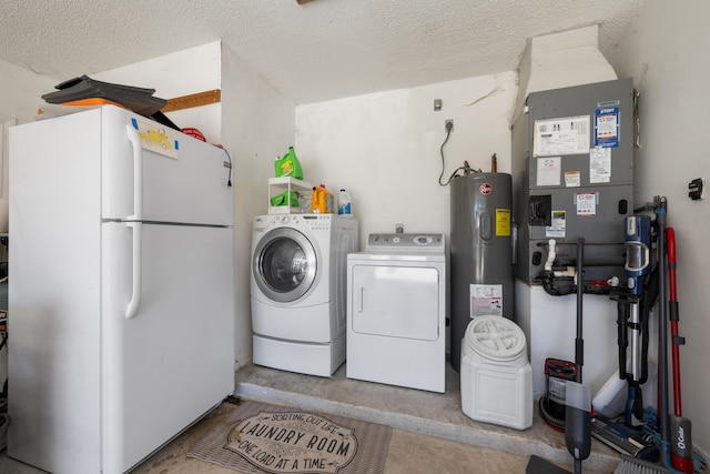 131 NE Naranja Ave, Port Saint Lucie, FL 34983 - washroom with water heater, laundry area, heating unit, a textured ceiling, and separate washer and dryer