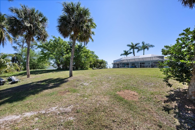 131 NE Naranja Ave, Port Saint Lucie, FL 34983 - view of yard featuring glass enclosure