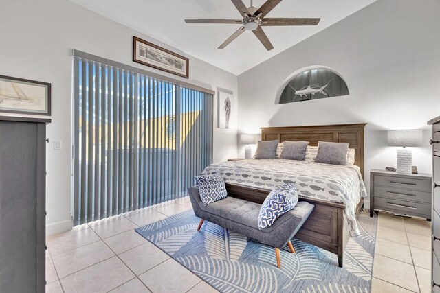 bedroom featuring light tile patterned floors, ceiling fan, and lofted ceiling