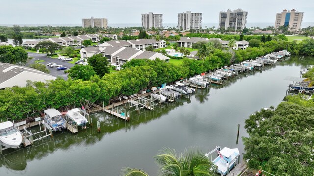 bird's eye view featuring a view of city and a water view