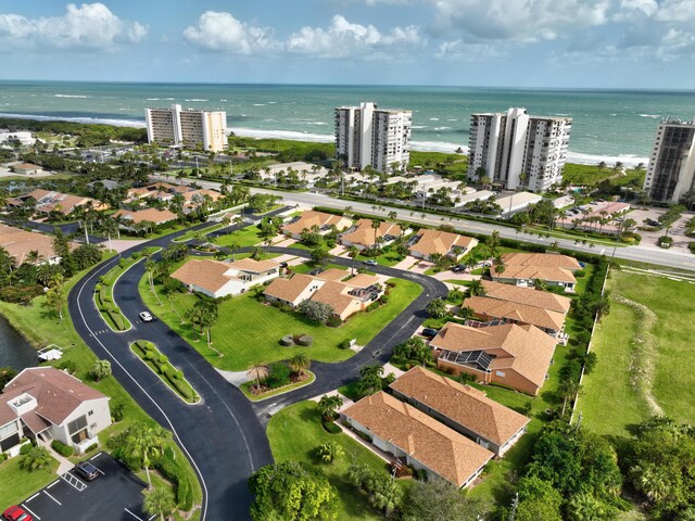 birds eye view of property featuring a view of city and a water view