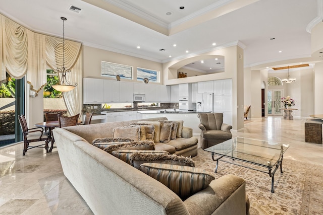 16137 Via Monteverde, Delray Beach, FL 33446 - living area featuring a tray ceiling, recessed lighting, marble finish floor, arched walkways, and visible vents