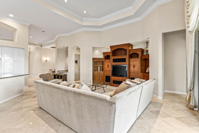 16137 Via Monteverde, Delray Beach, FL 33446 - living area featuring arched walkways, a tray ceiling, baseboards, and crown molding