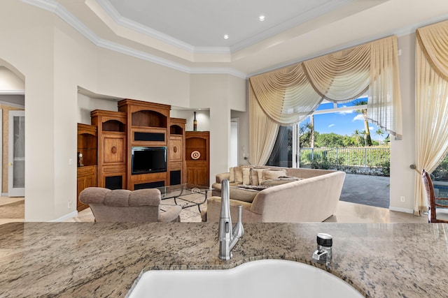 16137 Via Monteverde, Delray Beach, FL 33446 - living area featuring a raised ceiling, ornamental molding, arched walkways, a towering ceiling, and recessed lighting