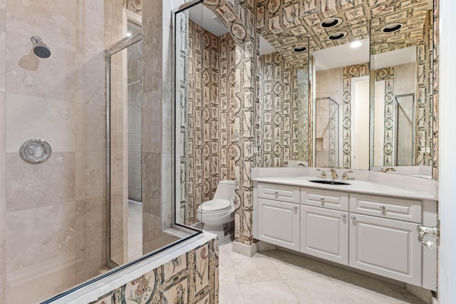16137 Via Monteverde, Delray Beach, FL 33446 - bathroom with toilet, a stall shower, vanity, and wallpapered walls