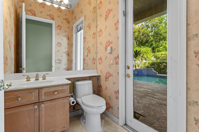 16137 Via Monteverde, Delray Beach, FL 33446 - half bath featuring tile patterned flooring, vanity, toilet, baseboards, and wallpapered walls