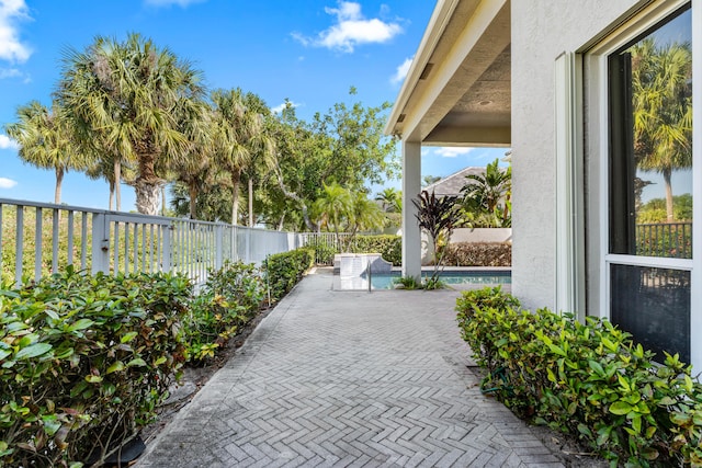 16137 Via Monteverde, Delray Beach, FL 33446 - view of patio featuring a fenced backyard and a fenced in pool
