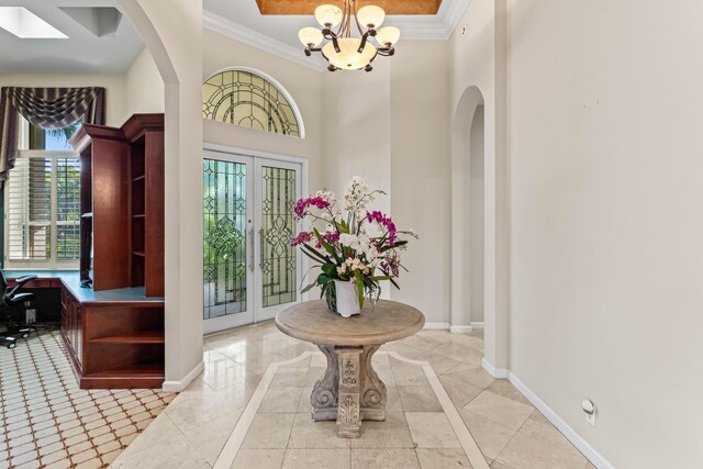 16137 Via Monteverde, Delray Beach, FL 33446 - foyer featuring french doors, ornamental molding, baseboards, and a wealth of natural light
