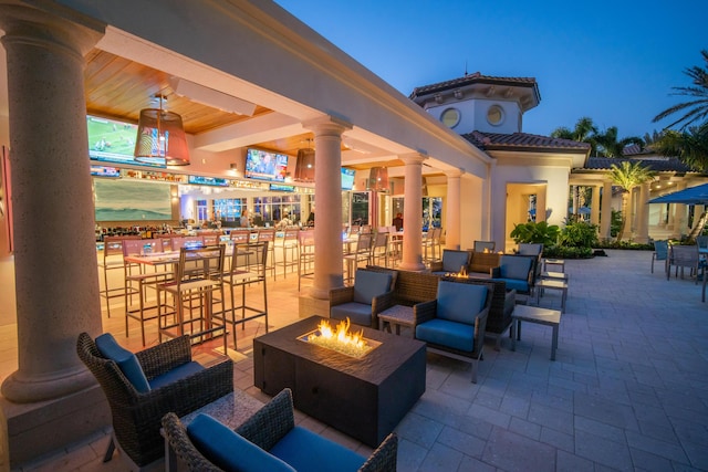 16137 Via Monteverde, Delray Beach, FL 33446 - view of patio / terrace featuring an outdoor living space with a fire pit