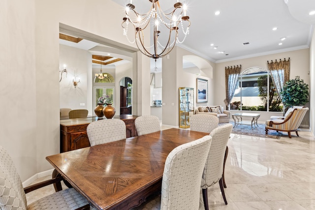 16137 Via Monteverde, Delray Beach, FL 33446 - dining room featuring baseboards, a notable chandelier, crown molding, and arched walkways
