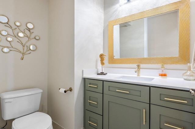 bathroom with toilet and vanity