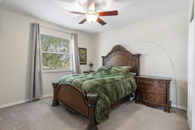 bedroom featuring carpet flooring, baseboards, and ceiling fan