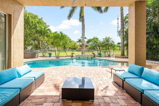 view of pool featuring a fenced backyard, an outdoor hangout area, a fenced in pool, and a patio